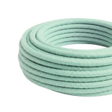 Cable textil redondo de algodón – Menta lechosa, rollo visto de tres cuartos