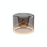 Bombilla LED donut E27 de cristal ahumado, Ø 120 mm, encendida, anillo de luz cálida, fondo blanco
