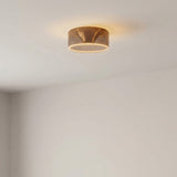 Bombilla LED donut E27 de cristal ahumado, Ø 195 mm, encendida en el techo de una habitación de paredes claras