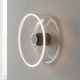 Bombilla LED donut E27 de cristal transparente, Ø 195 mm, como aplique de pared con un halo de luz cálida