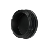 Tapón de plástico negro para racor hembra 1″1/4 33x42, vista inferior: cuerpo hueco y aletas