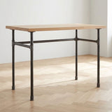 Escritorio industrial con tablero de roble claro sobre estructura en U de hierro fundido y acero Ø 27 mm, ambiente (tablero no incluido)